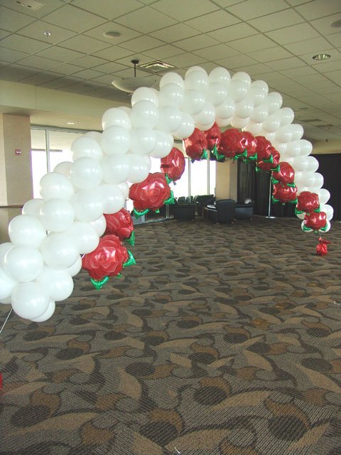rose themed wedding balloon arch